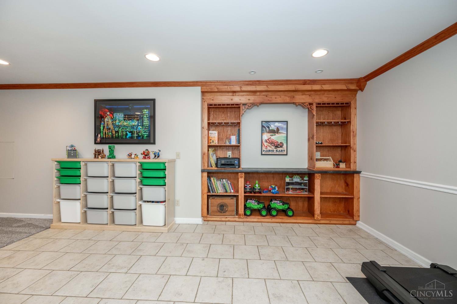 11624 Edgewood Road Harrison, OH 45030 - Photo 39 of 54 Recreation room with built in shelves.