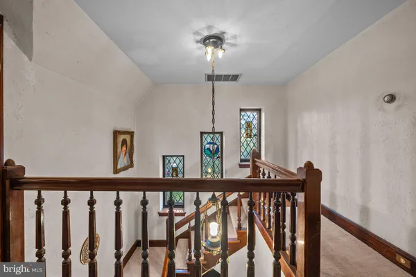 a view of a hallway with windows