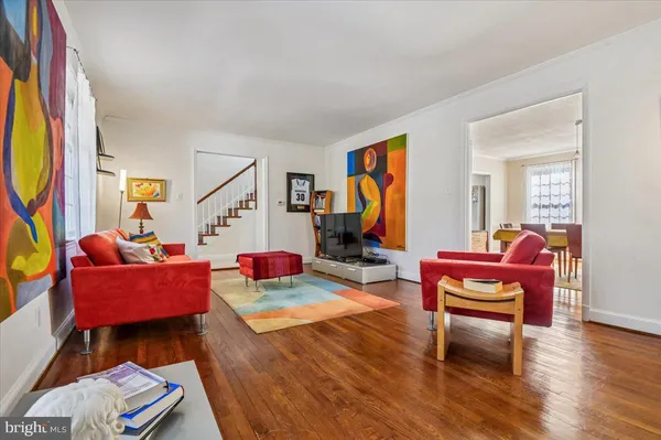 a living room with furniture a rug and a fireplace