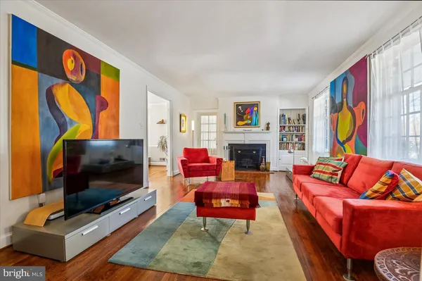 a view of a dining room with furniture large windows and wooden floor