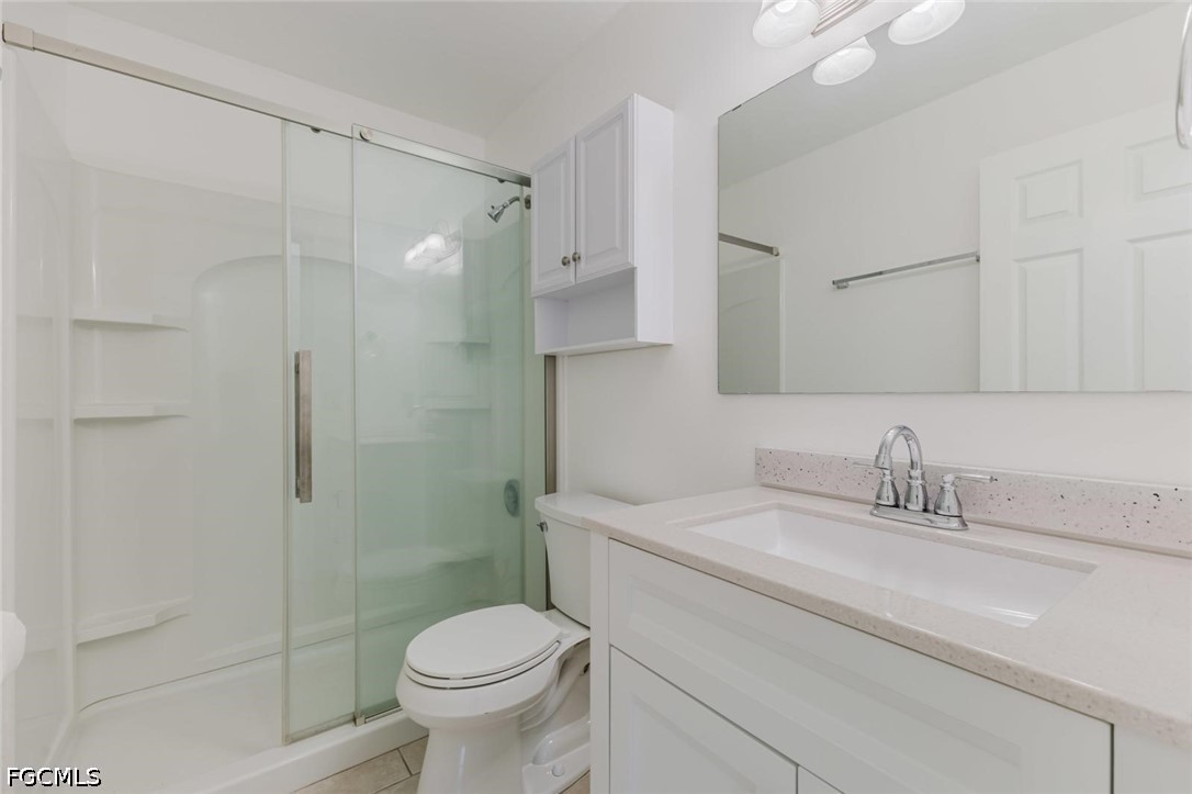 16595 Davis Road Fort Myers, FL 33908 - Photo 9 of 31 a bathroom with a sink toilet and shower