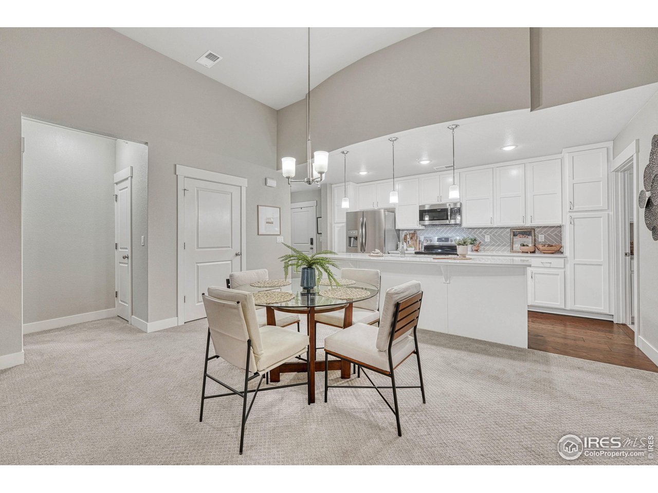 6582 Crystal Downs Drive, Unit 207 Windsor, CO 80550 - Photo 9 of 40 Dining area between kitchen and living room