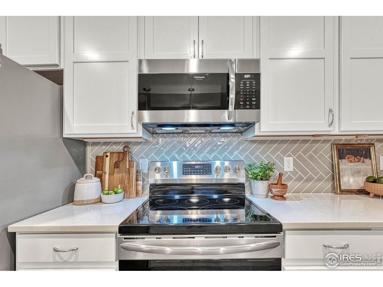 6582 Crystal Downs Drive, Unit 207 Windsor, CO 80550 - Photo 10 of 40 SS Appliances, Quartz countertops, and high end finishes