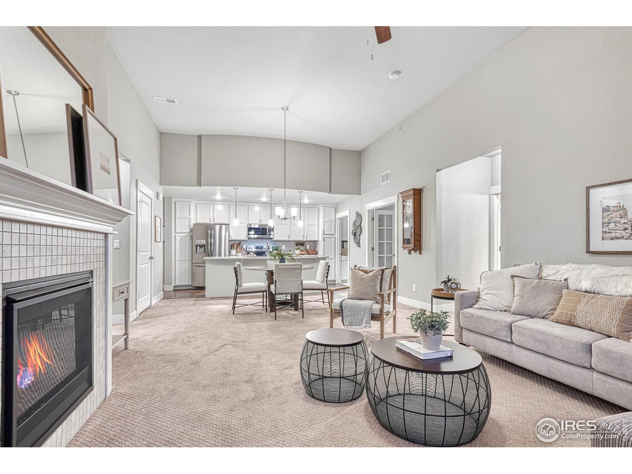 6582 Crystal Downs Drive, Unit 207 Windsor, CO 80550 - Photo 15 of 40 Dining area flows it living room space in front of the fireplace