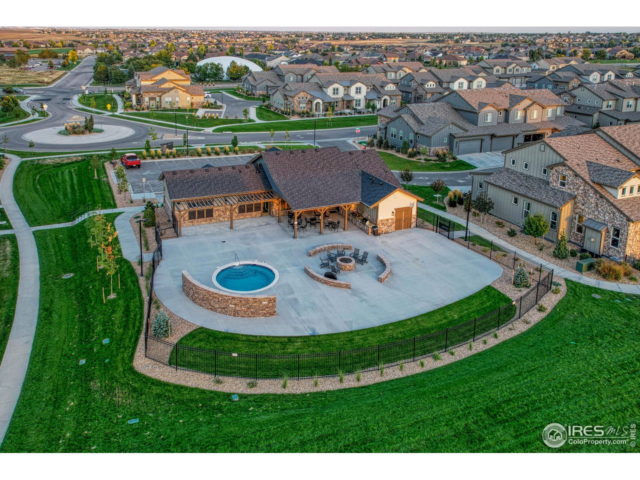 6582 Crystal Downs Drive, Unit 207 Windsor, CO 80550 - Photo 35 of 40 Clubhouse with kitchen, bathrooms, workout room, sauna, hot tub, fire pit, and incredible views. Abuts pond.
