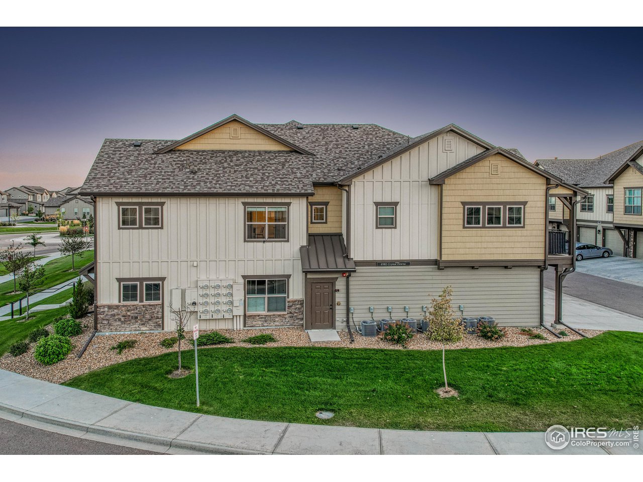 6582 Crystal Downs Drive, Unit 207 Windsor, CO 80550 - Photo 4 of 40 Exterior of building; north facing.