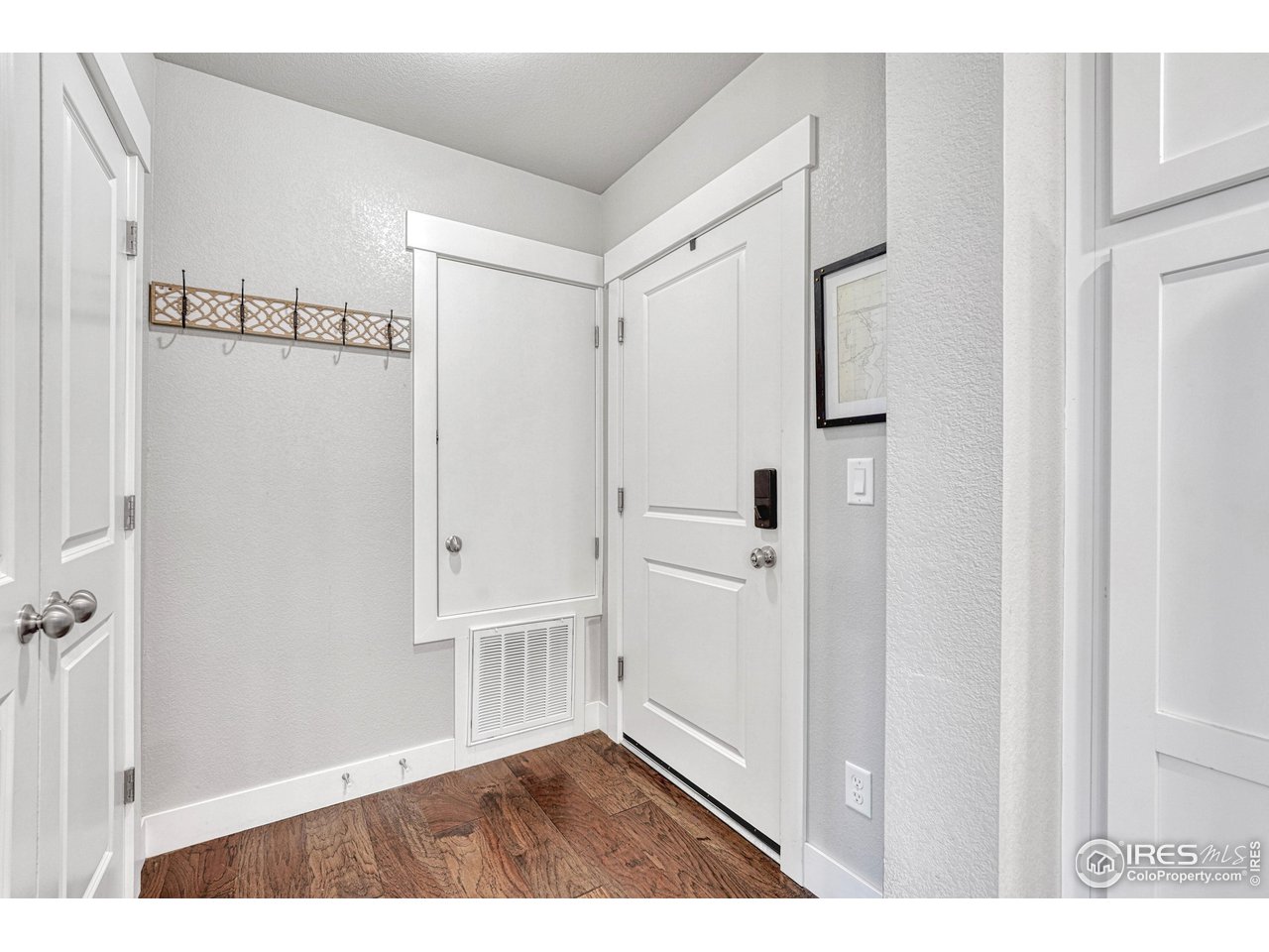 6582 Crystal Downs Drive, Unit 207 Windsor, CO 80550 - Photo 7 of 40 Entry way with furnace closet and large front entry coat closet with extra room for storage