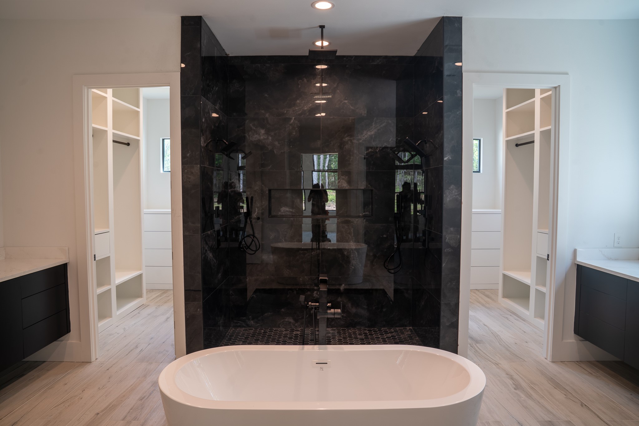 343 Sundog Road Huntsville, TX 77340 - Photo 21 of 37 Well-designed primary bathroom with oversized shower, soaking tub, and double sinks.