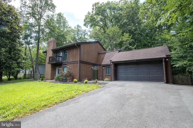 a backyard of a house with yard and garage