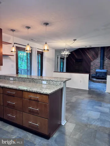 a kitchen with a sink and a stove top oven