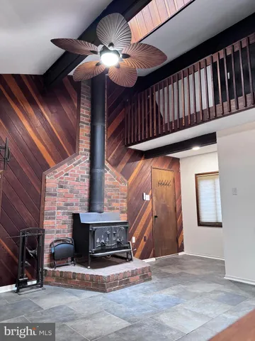 a view of hall way with fireplace