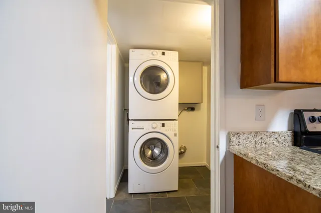 a utility room with sink dryer and washer
