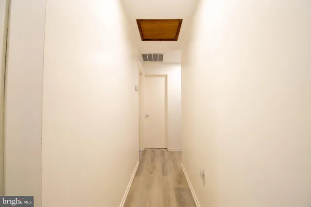 a view of a bathroom with a sink and a mirror