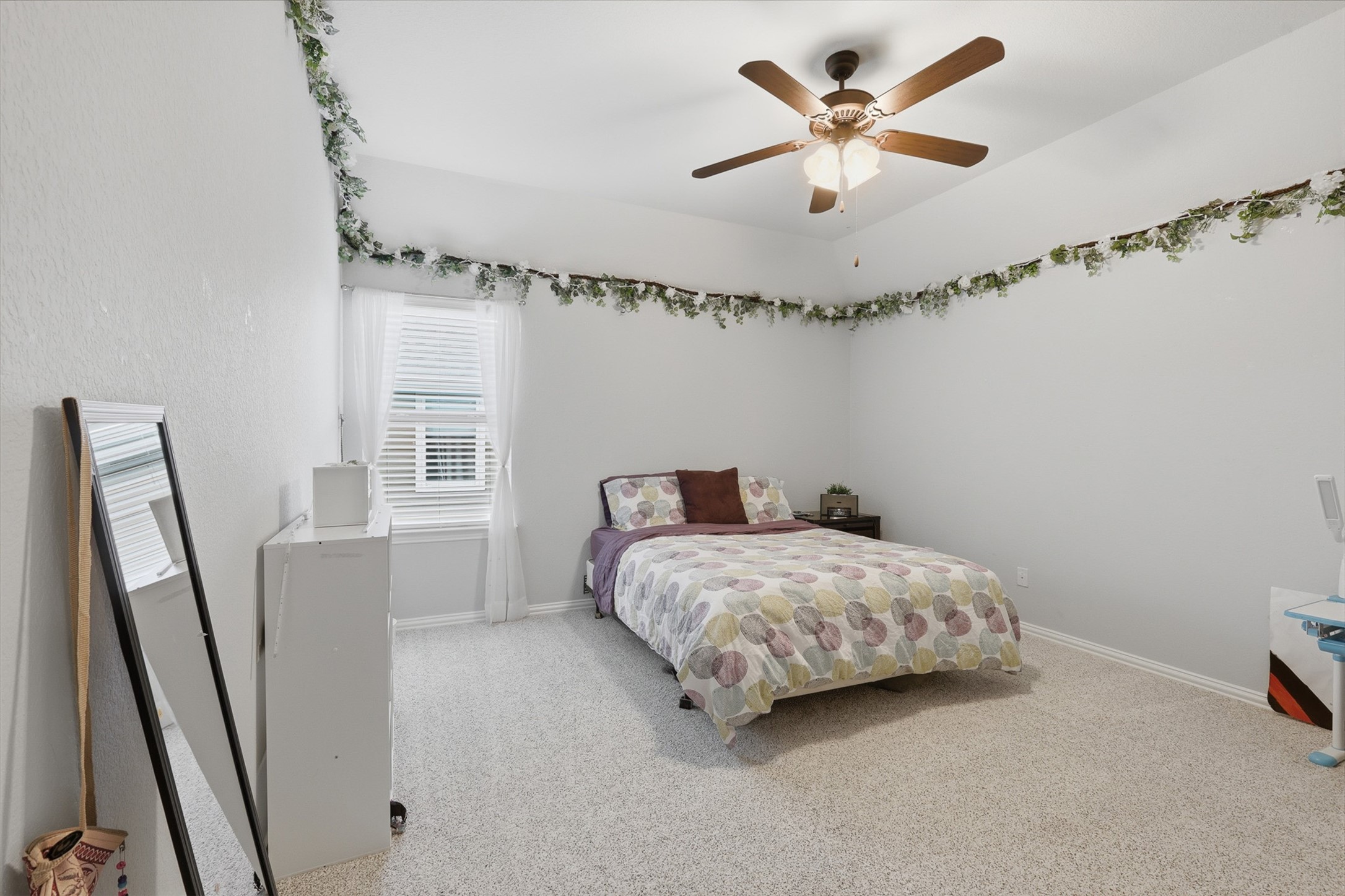 6835 Preston Grove Drive Spring, TX 77389 - Photo 36 of 49 a bedroom with a bed and a large window