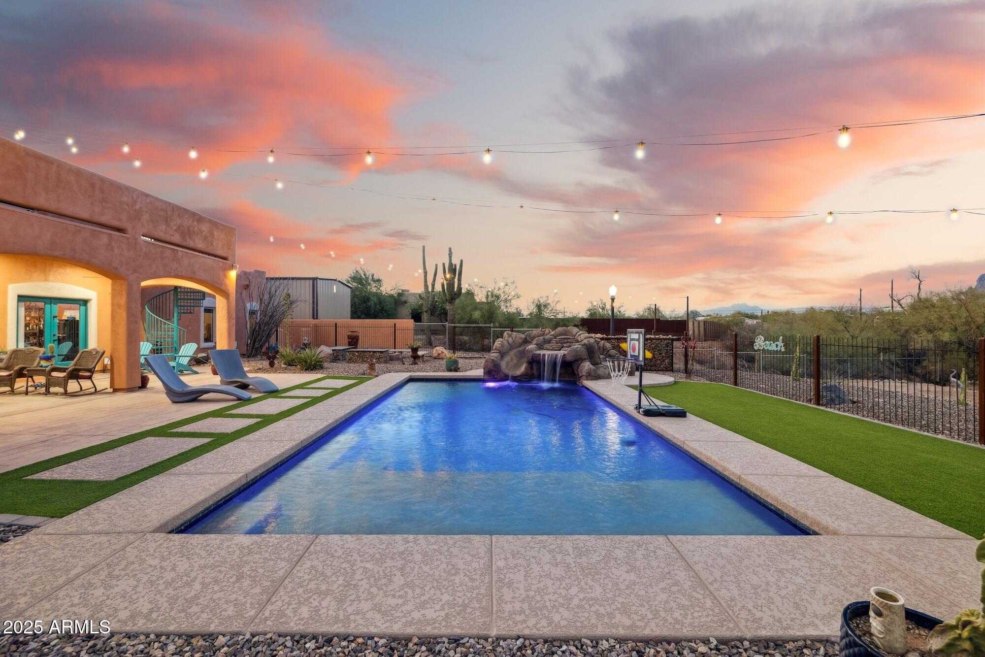 655 South Conestoga Road Apache Junction, AZ 85119 - Photo 13 of 79 a view of a swimming pool and lounge chairs