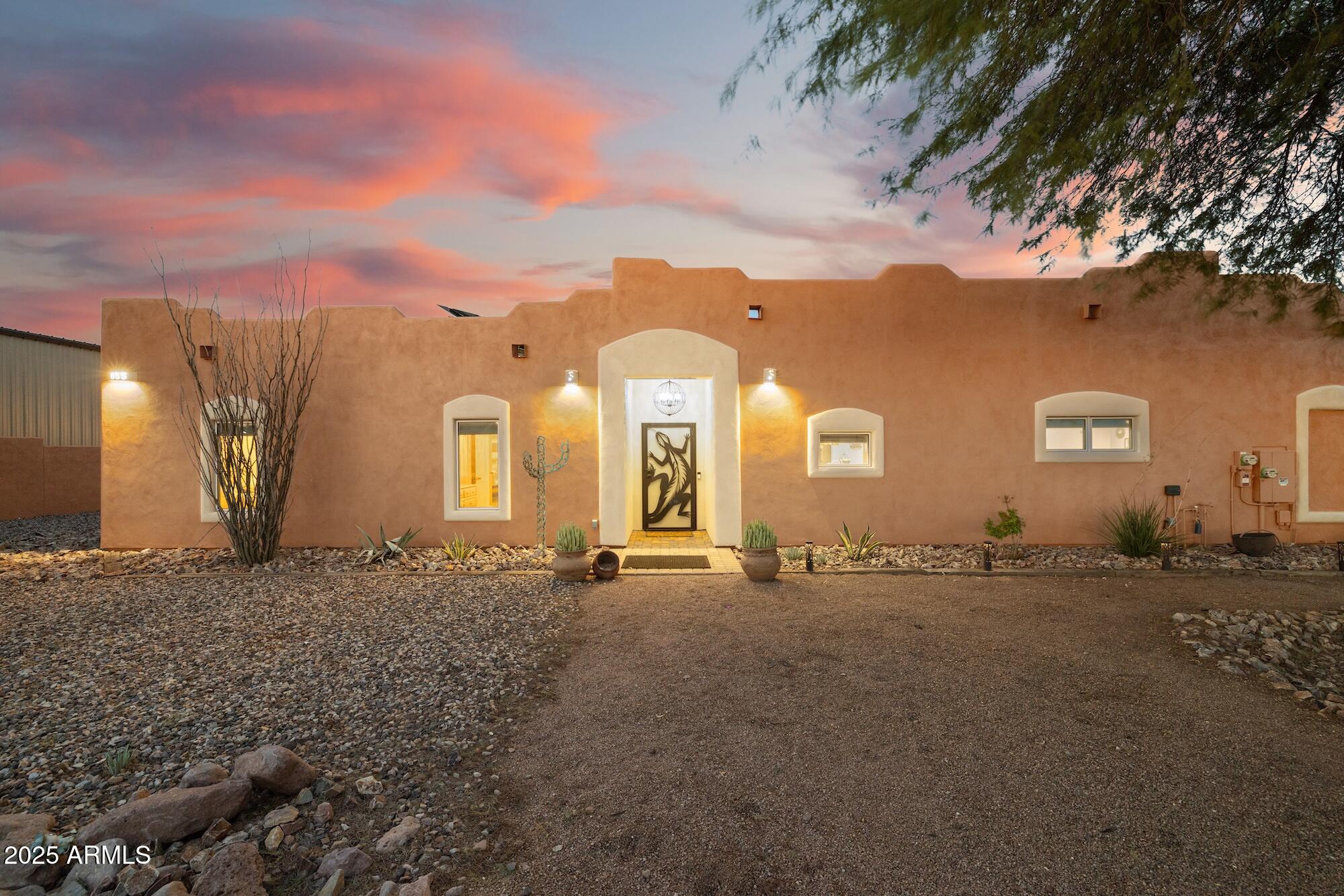 655 South Conestoga Road Apache Junction, AZ 85119 - Photo 16 of 79 a view of a house with a backyard