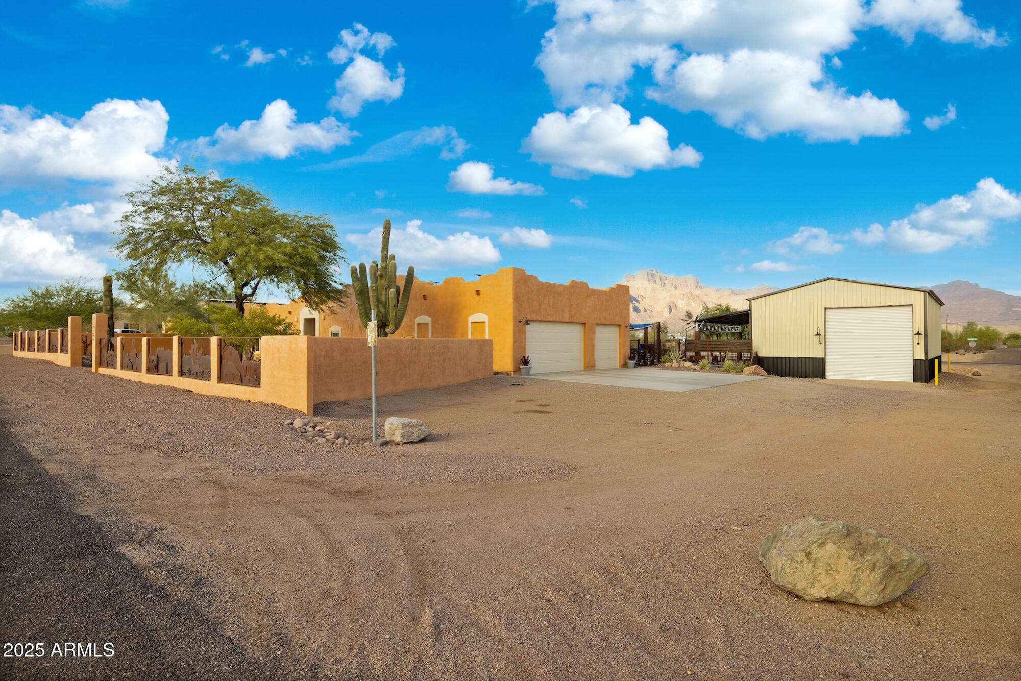 655 South Conestoga Road Apache Junction, AZ 85119 - Photo 28 of 79 a view of a house with a backyard