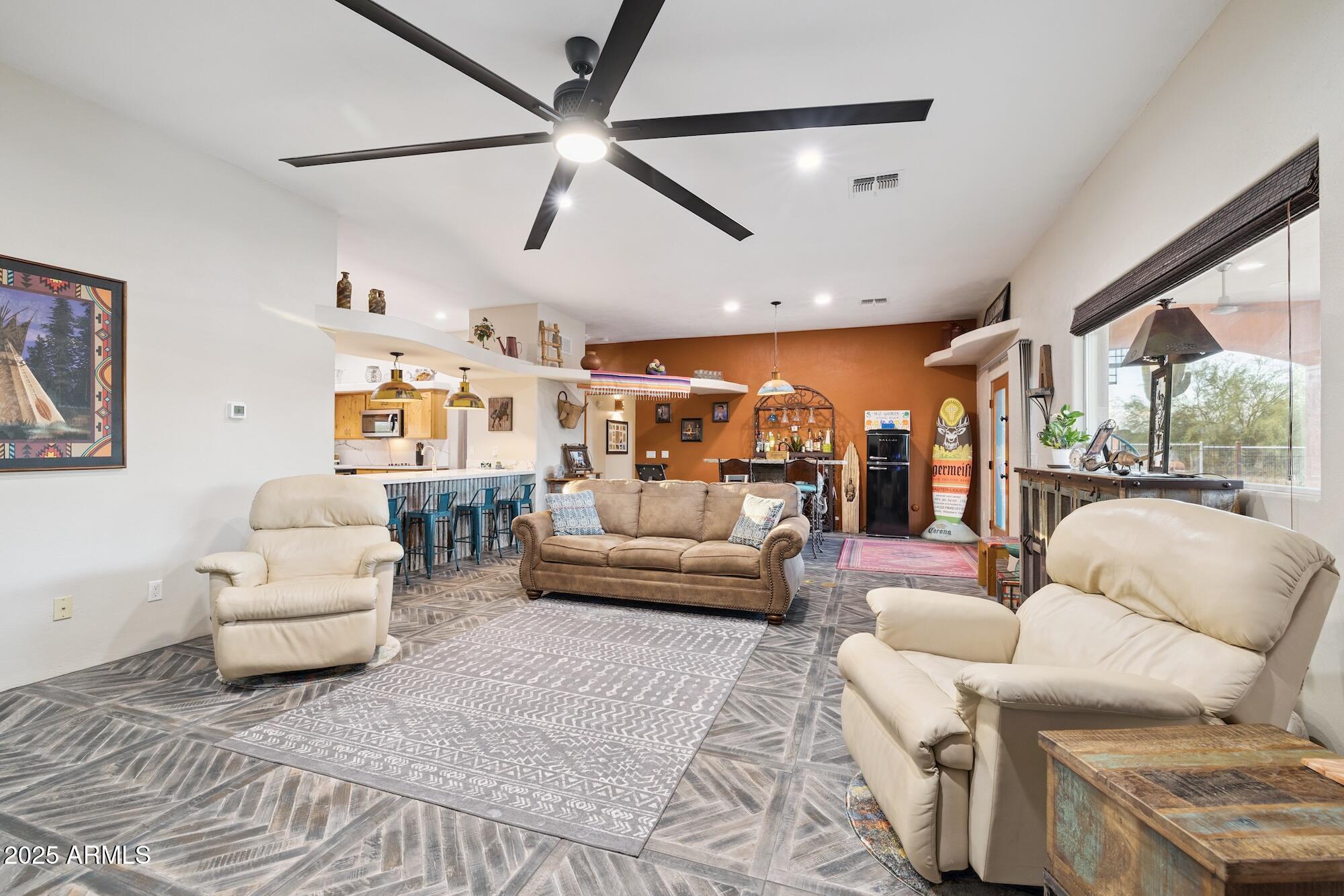 655 South Conestoga Road Apache Junction, AZ 85119 - Photo 36 of 79 a living room with furniture and a large window