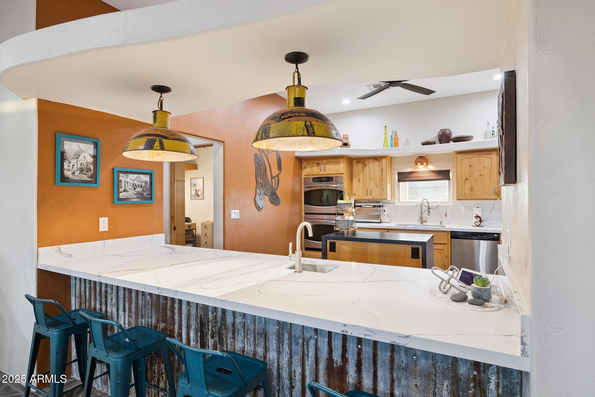 655 South Conestoga Road Apache Junction, AZ 85119 - Photo 39 of 79 a bed room with a bed and a chandelier