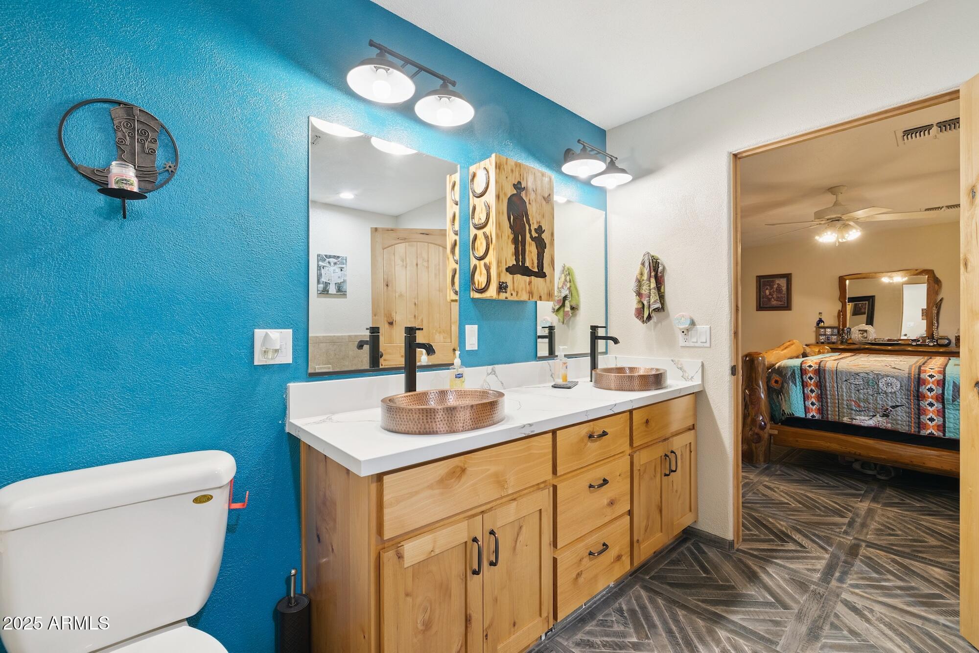 655 South Conestoga Road Apache Junction, AZ 85119 - Photo 55 of 79 a bathroom with a toilet sink and mirror