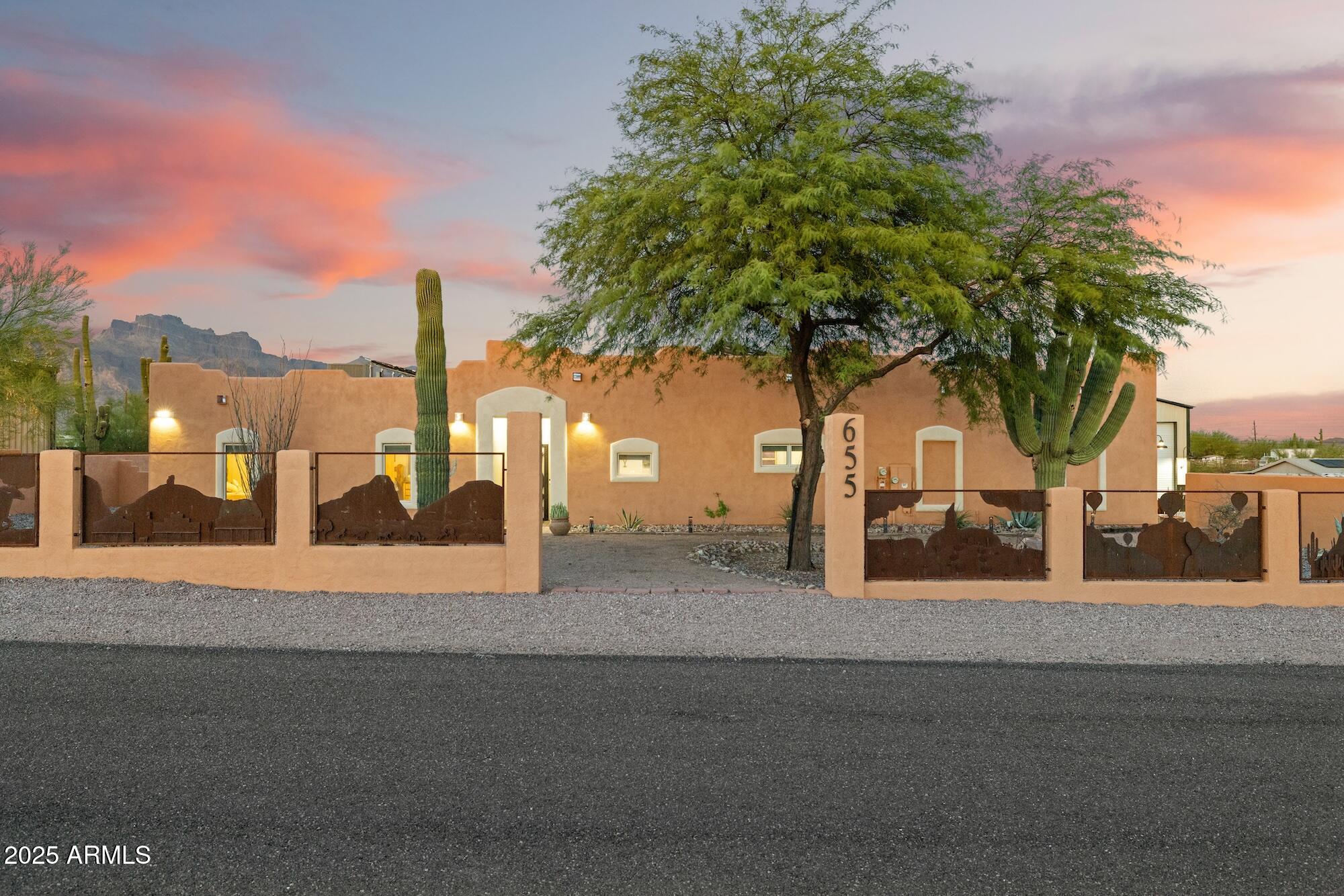 655 South Conestoga Road Apache Junction, AZ 85119 - Photo 6 of 79 a view of a street with palm trees
