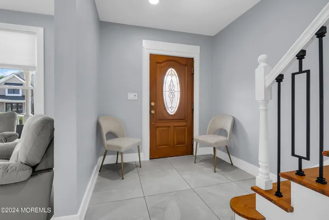 a view of a livingroom with furniture and a chair