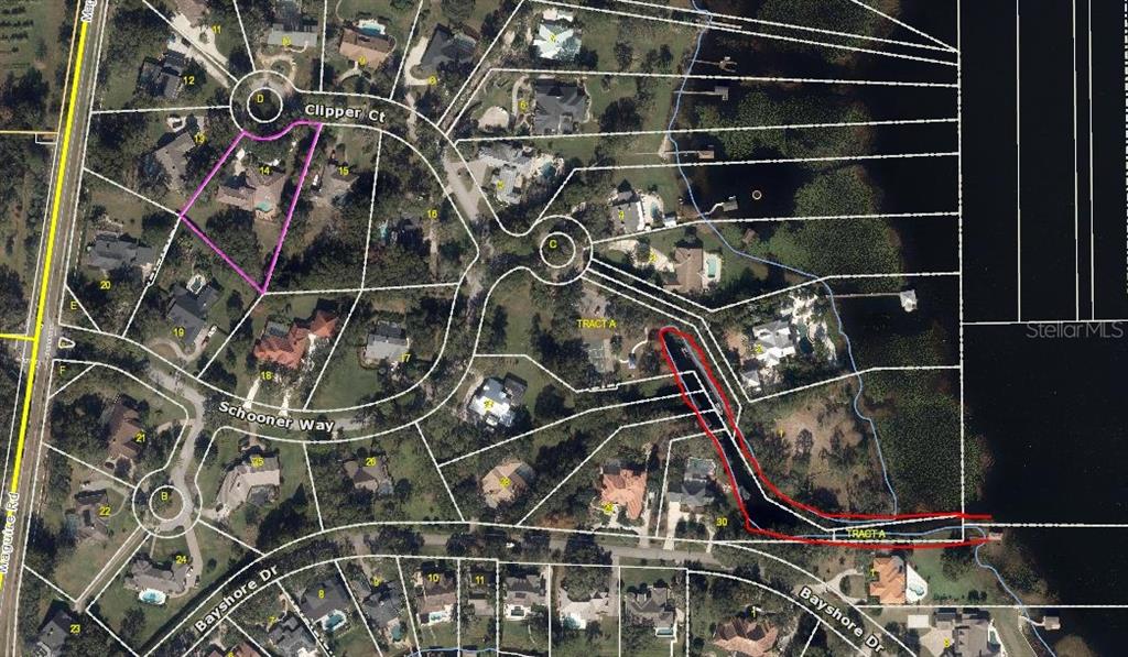 a water heater and room with wooden floor