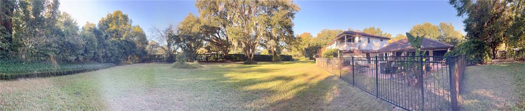 11056 Clipper Court Windermere, FL 34786 - Photo 15 of 18 a view of swimming pool with a yard and trees