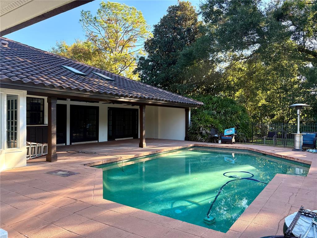 11056 Clipper Court Windermere, FL 34786 - Photo 16 of 18 a front view of a house with a yard and porch