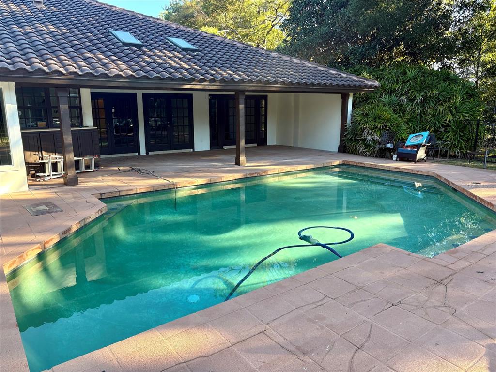 11056 Clipper Court Windermere, FL 34786 - Photo 17 of 18 a view of a house with swimming pool and a yard