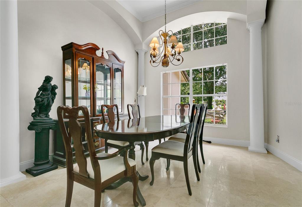 11056 Clipper Court Windermere, FL 34786 - Photo 4 of 18 a view of a dining room with furniture and chandelier