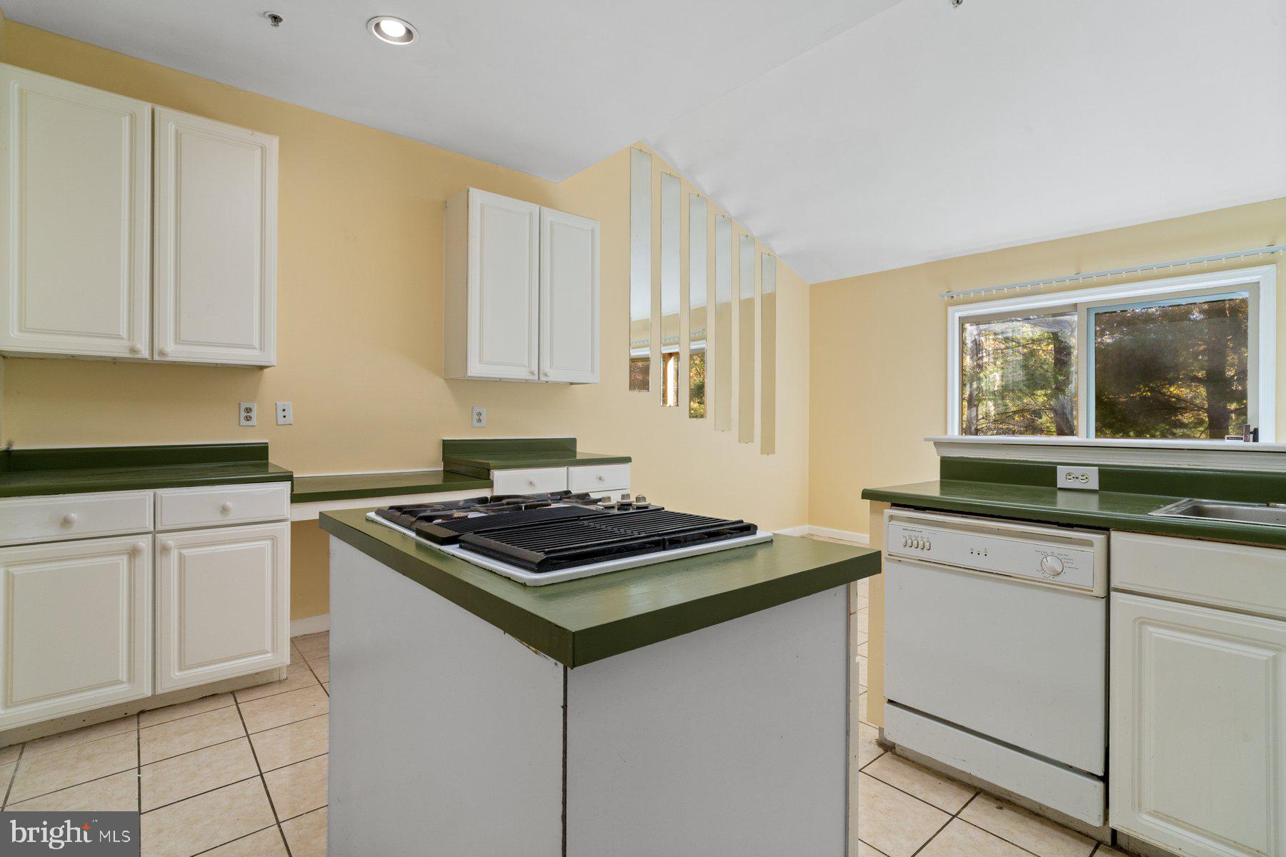 11 Bank Spring Court Owings Mills, MD 21117 - Photo 10 of 35 a kitchen with granite countertop white cabinets and white appliances