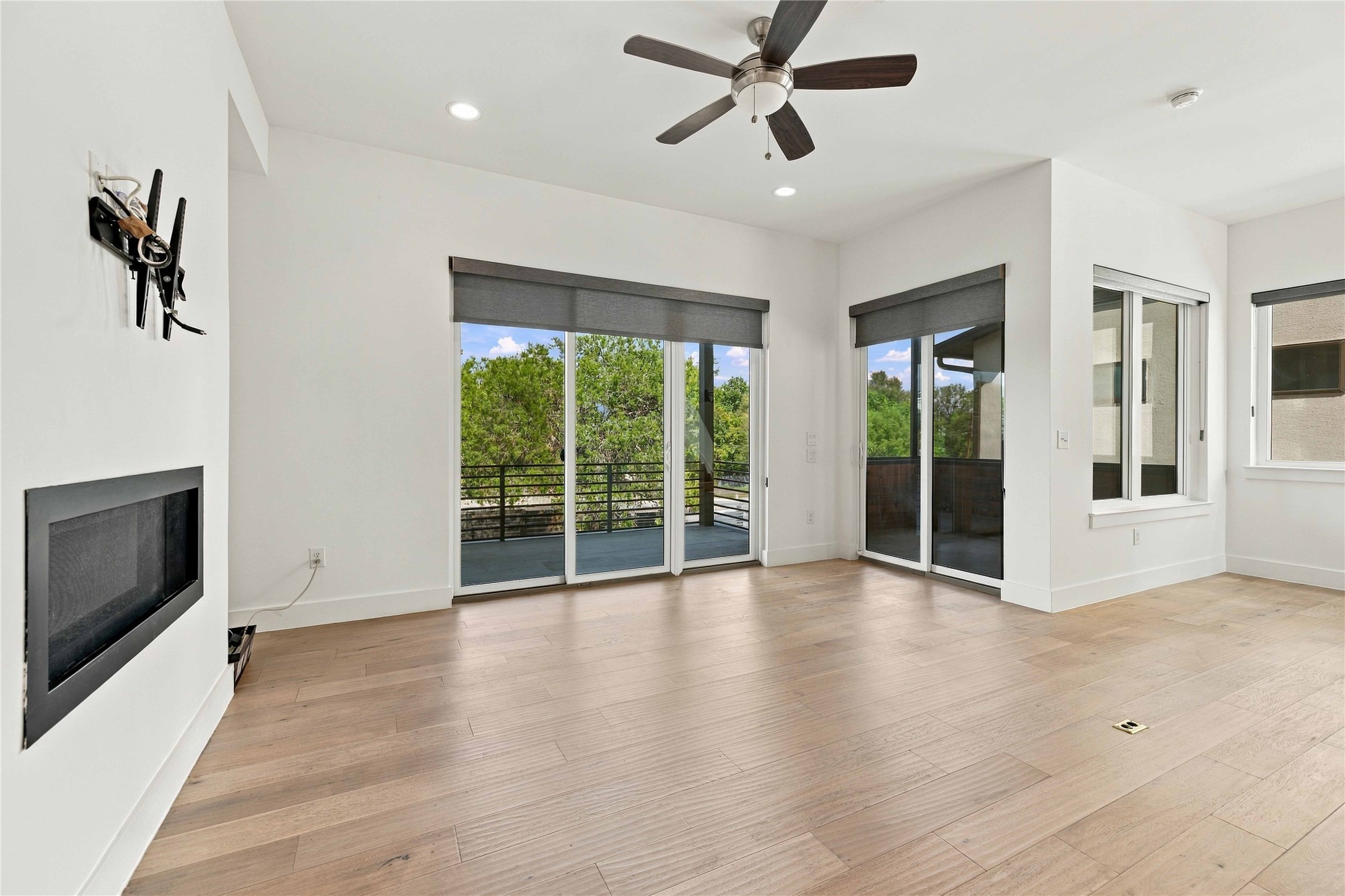 5006 Pecan Springs Road, Unit 7 Austin, TX 78723 - Photo 7 of 38 Hardwood floors and sliding glass doors define this open living area.