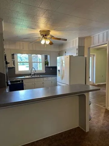 a view of a living room and chandelier