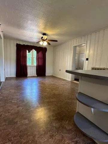 a view of kitchen with cabinets and wooden floor