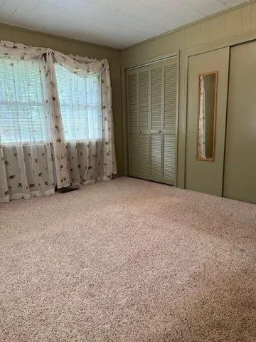 a view of an empty room with window