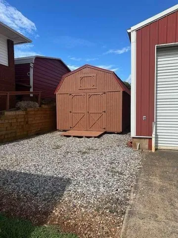 a view of house with backyard and pool