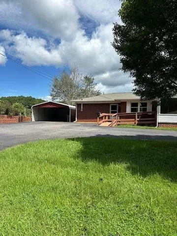 an outdoor view of a house having patio