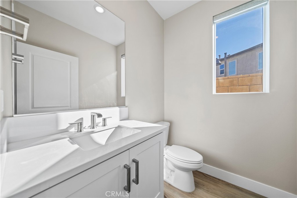 124 Zawn Irvine, CA 92618 - Photo 19 of 56 a bathroom with a toilet a sink and mirror