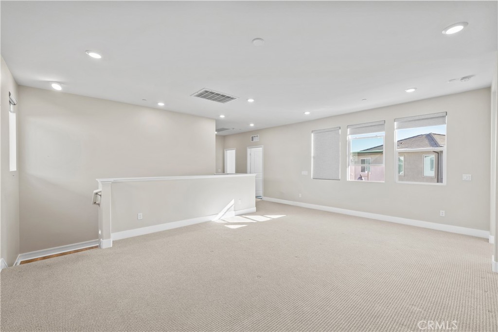 124 Zawn Irvine, CA 92618 - Photo 25 of 56 a view of an empty room with a window