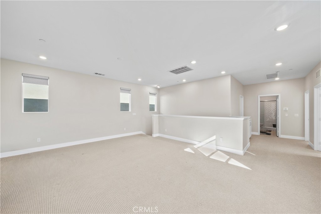 124 Zawn Irvine, CA 92618 - Photo 26 of 56 an empty room with a empty space and windows