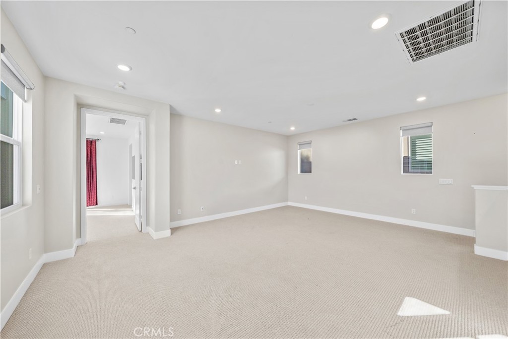 124 Zawn Irvine, CA 92618 - Photo 27 of 56 a view of an empty room with a window