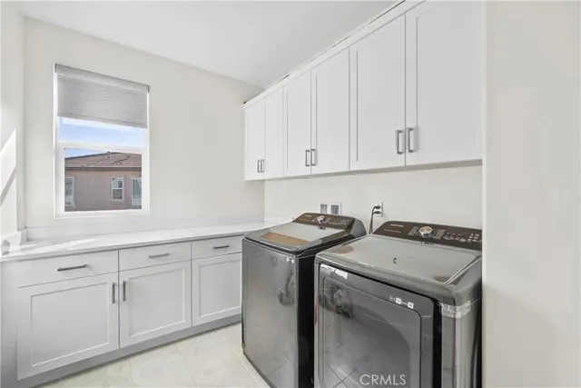 an empty room with ceiling fan and window