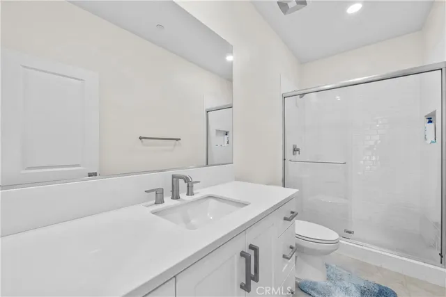 a view of a livingroom with a ceiling fan and window