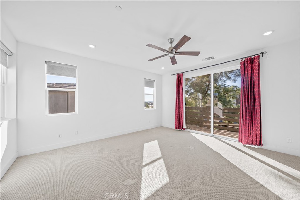 124 Zawn Irvine, CA 92618 - Photo 33 of 56 a view of a livingroom with a ceiling fan and window