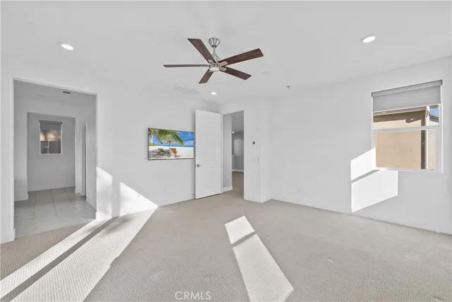 a spacious bathroom with a bathtub and mirror