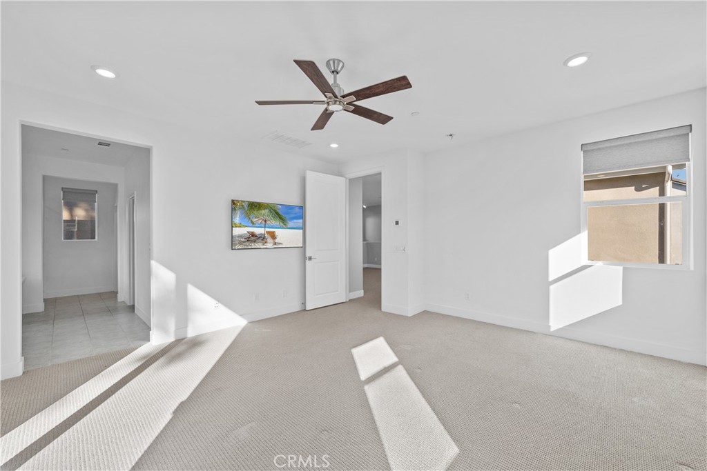 124 Zawn Irvine, CA 92618 - Photo 35 of 56 a view of a livingroom with a ceiling fan and window