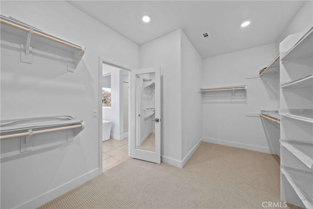 124 Zawn Irvine, CA 92618 - Photo 40 of 56 a view of walk in closet with empty racks