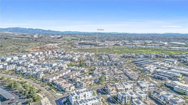an aerial view of a city with ocean