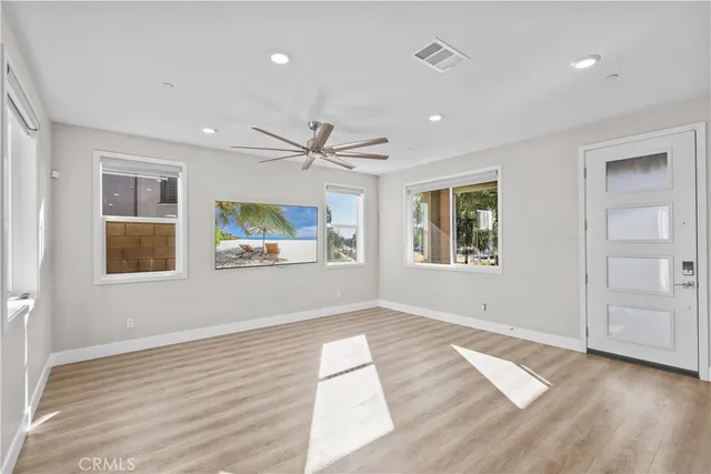 a view of a kitchen with kitchen island a hard wood floor